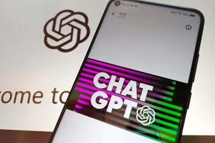 Smartphone displaying ChatGPT logo with OpenAI branding in the background