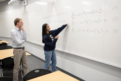 Divya Tyagi, a Penn State engineering grad student, presents her math breakthrough to adviser Sven Schmitz.