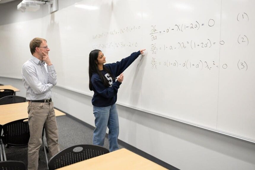 Divya Tyagi, a Penn State engineering grad student, presents her math breakthrough to adviser Sven Schmitz.